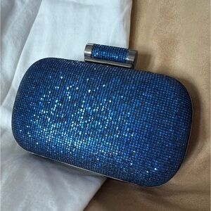 Sparkle blue clutch w/ inner pocket and two chain lengths.